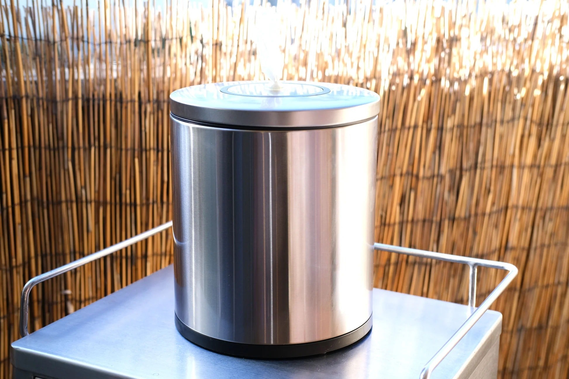 Stainless steel tissue dispenser on table