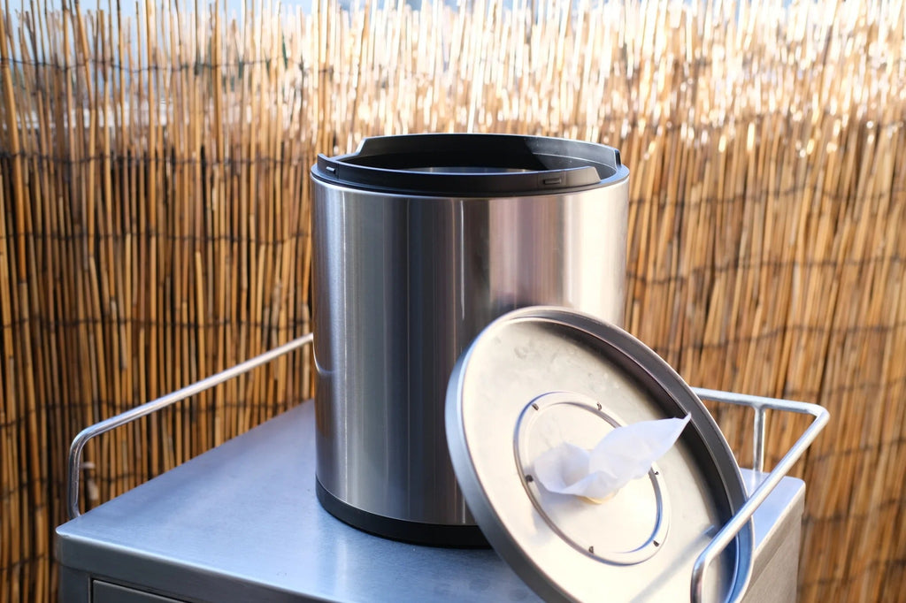 Stainless steel desktop tissue dispenser with lid open