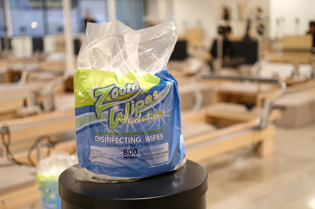 Disinfecting gym wipes in plastic packaging on table
